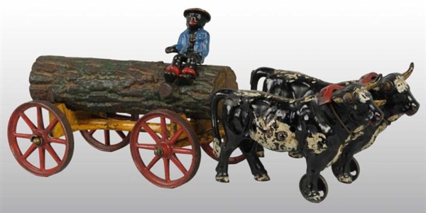 CAST IRON HUBLEY 2-OXEN LOG WAGON TOY.            