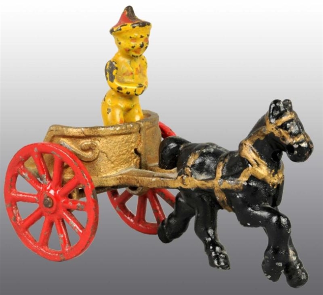 CAST IRON GOLD CHARIOT TOY WITH CLOWN.            