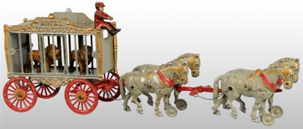 CAST IRON 4-HORSE ROYAL CIRCUS CAGE WAGON TOY.    