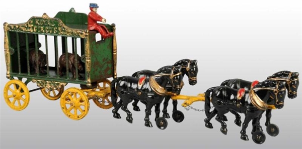 CAST IRON 4-HORSE ROYAL CIRCUS CAGE WAGON TOY.    
