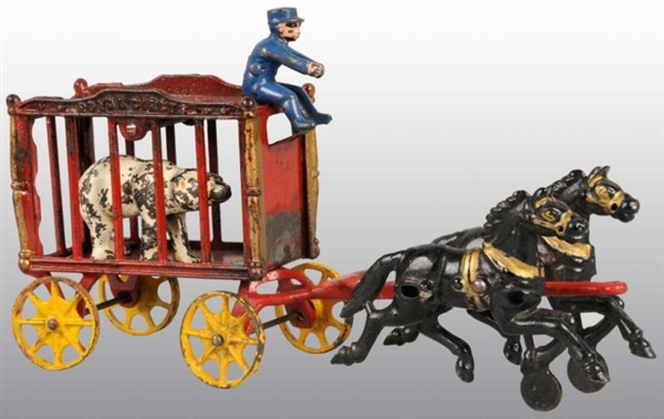 CAST IRON 2-HORSE  RED ROYAL CIRCUS WAGON.        