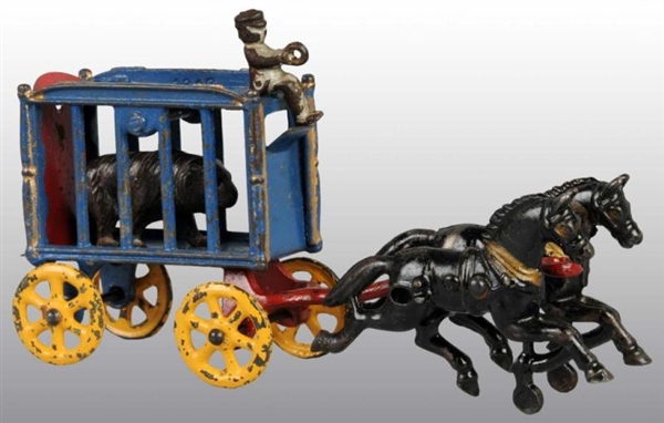 CAST IRON 2-HORSE CAGE WAGON TOY.                 
