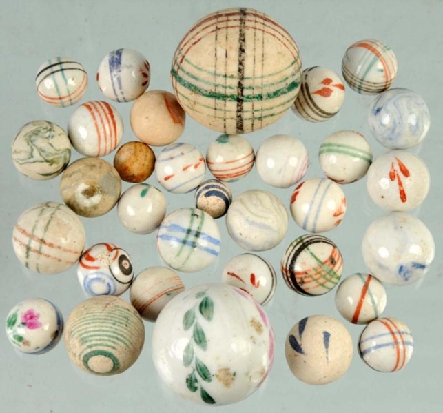 LOT OF 33: HAND-PAINTED CHINA MARBLES.            