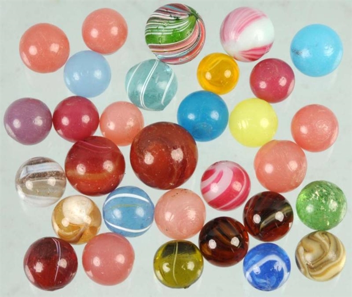 LOT OF 31: EARLY HAND-MADE MARBLES.               
