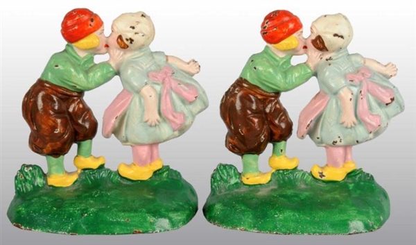 CAST IRON DUTCH BOY AND GIRL BOOKENDS.            