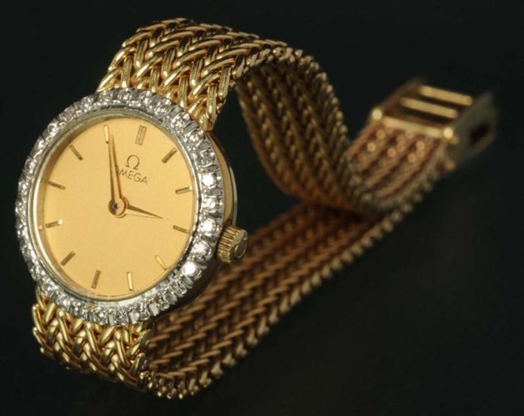 ANTIQUE JEWELRY 14K GOLD OMEGA LADIES WATCH.      