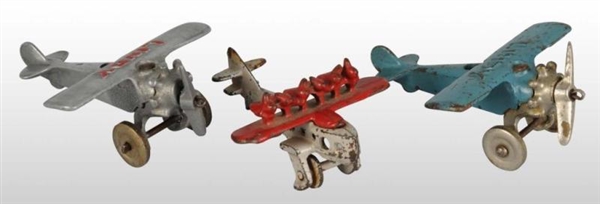 LOT OF 3: CAST IRON AIRPLANE TOYS.                