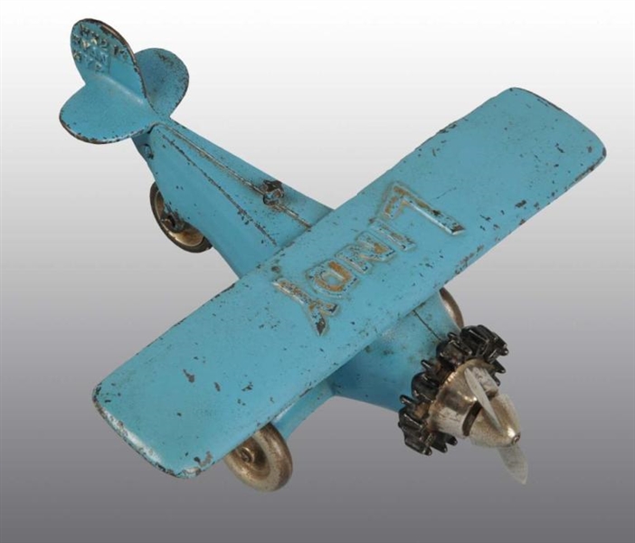 CAST IRON BLUE LINDY AIRPLANE RATCHET DRIVE TOY.  