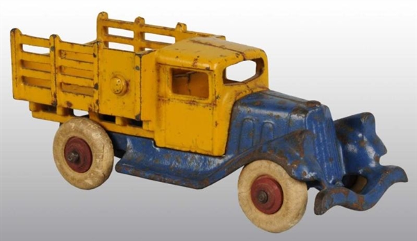 CAST IRON HUBLEY STAKE TRUCK TOY.                 