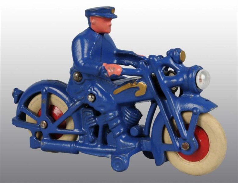 CAST IRON POLICE CYCLE TOY.                       