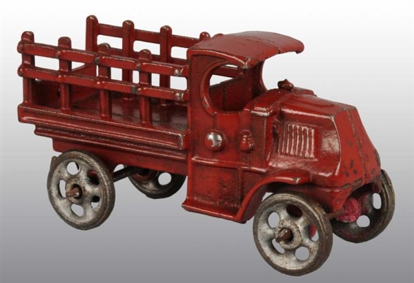 CAST IRON STAKE TRUCK TOY.                        