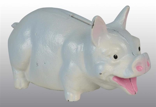 CAST IRON LAUGHING PIG STILL BANK.                