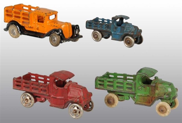 LOT OF 4: CAST IRON STAKE TRUCK TOYS.             