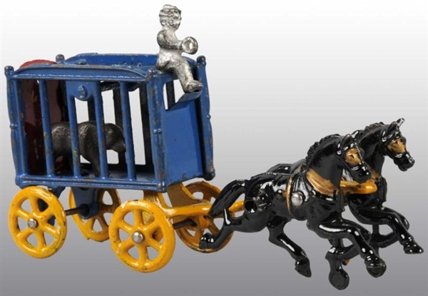 CAST IRON 2-HORSE CIRCUS CAGE WAGON TOY.          