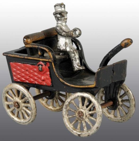 CAST IRON EARLY AUTOMOBILE TOY.                   