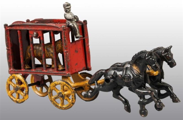CAST IRON 2-HORSE CIRCUS CAGE WAGON TOY.          