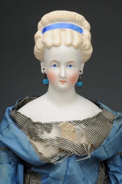 PARIAN LADY WITH BLUE HAIR BAND.                  