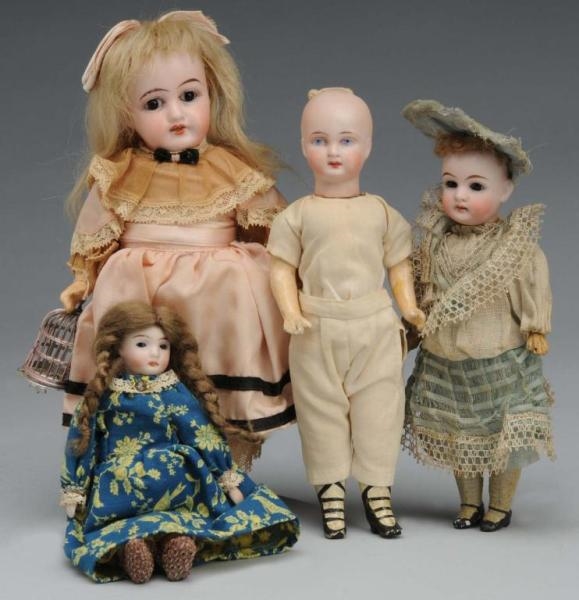 LOT OF 4: GERMAN BISQUE DOLLS.                    