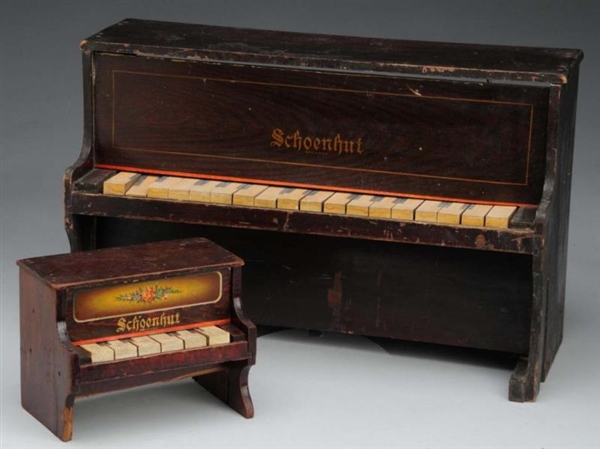 LOT OF 2: SCHOENHUT PIANOS.                       