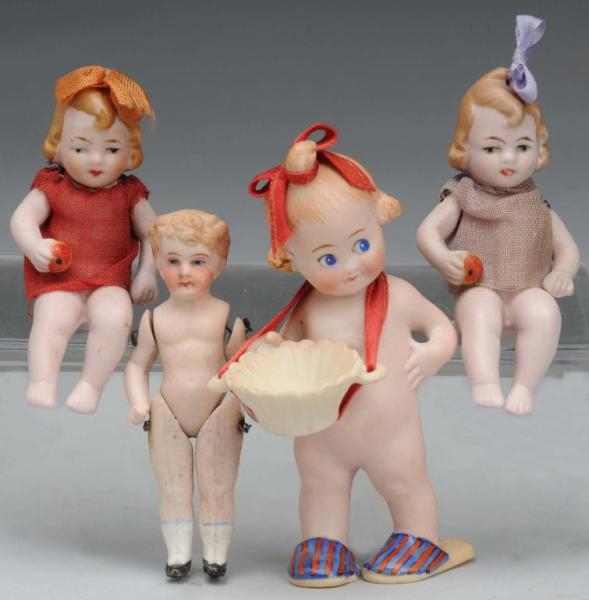 LOT OF 4: BISQUE DOLLS.                           