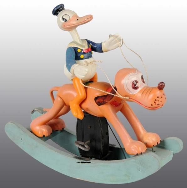 CELLULOID DONALD DUCK RIDING PLUTO ROCKING TOY.   