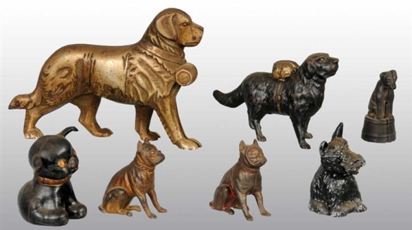 LOT OF 7: MISCELLANEOUS DOG STILL BANKS.          