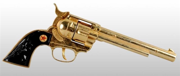 HUBLEY COWBOY GOLD-PLATED TOY CAP GUN.            