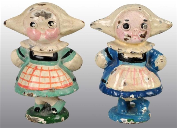 LOT OF 2: CAST IRON DUTCH GIRL PAPERWEIGHTS.      