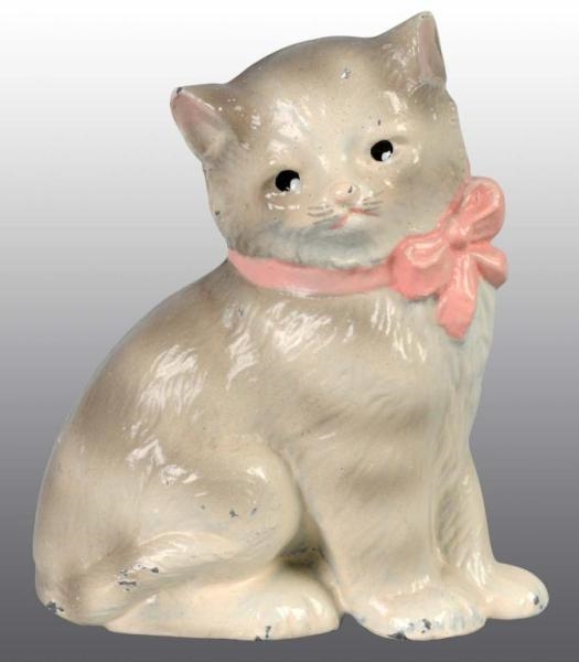CAST IRON KITTEN WITH BOW PAPERWEIGHT.            