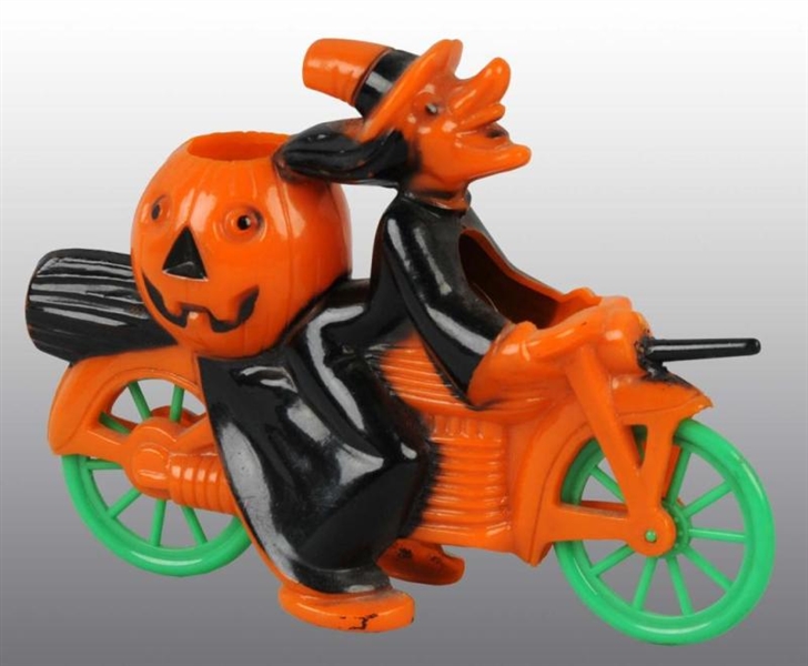 PLASTIC WITCH ON MOTORCYCLE HALLOWEEN PIECE.      