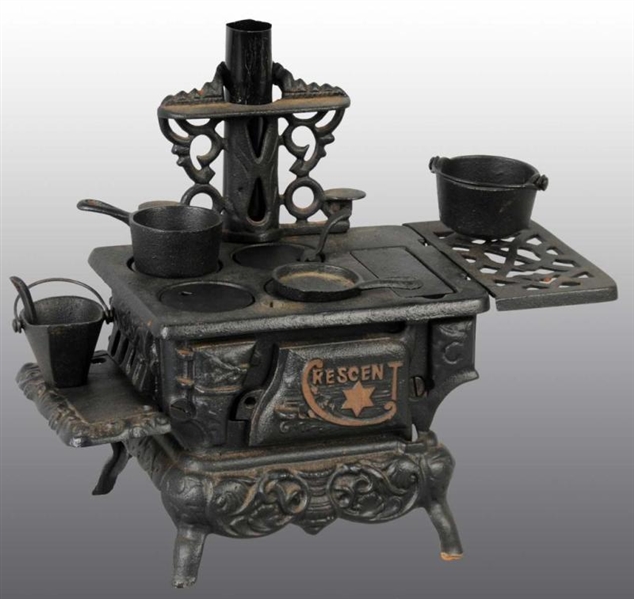 CAST IRON CRESCENT CHILDS TOY STOVE.             