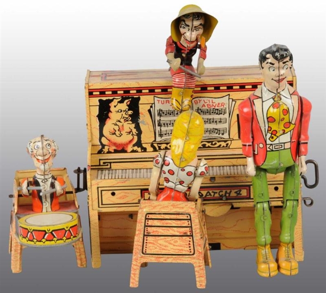 TIN UNIQUE ART LIL ABNER BAND WINDUP TOY.        