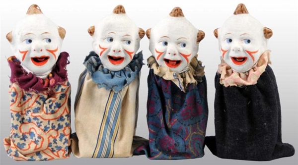 LOT OF 4: COMPOSITION CLOWN SQUEEZE TOYS.         