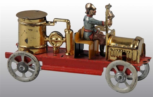 TIN FIRE PUMPER PENNY TOY.                        