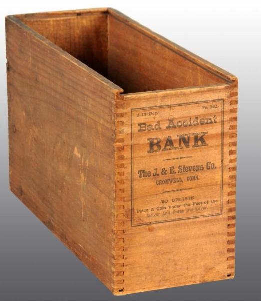 WOODEN BAD ACCIDENT MECHANICAL BANK BOX.          