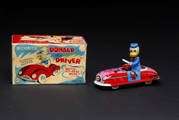 TIN MARX DISNEY DONALD THE DRIVER WIND-UP TOY.    