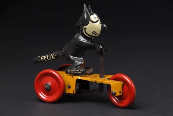 TIN FELIX SCOOTER WIND-UP TOY.                    