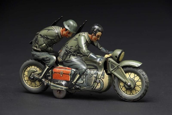 TIN CKO MILITARY MOTORCYCLE WIND-UP TOY.          