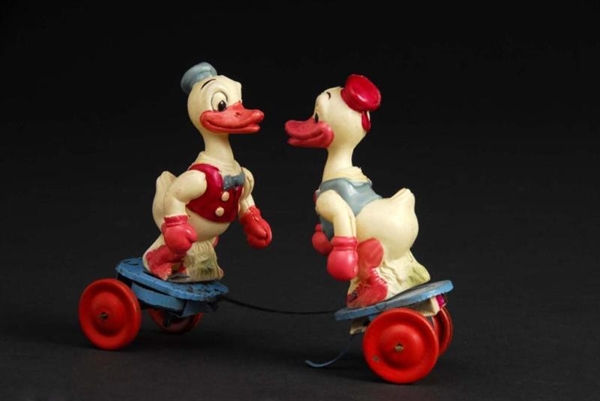 CELLULOID DUCK FIGHTING WIND-UP TOY.              