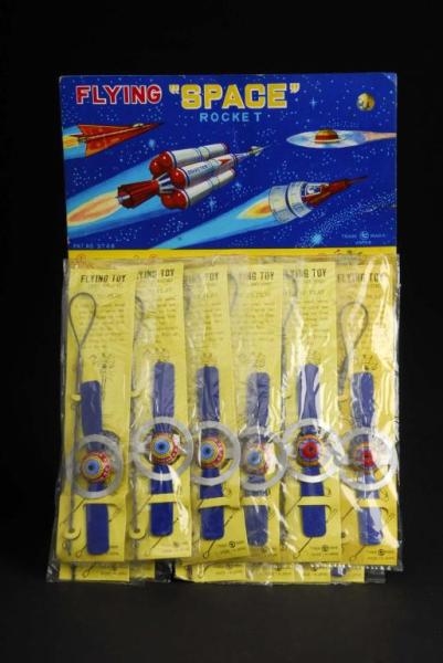 FLYING SPACE TOYS ON DISPLAY CARD.                