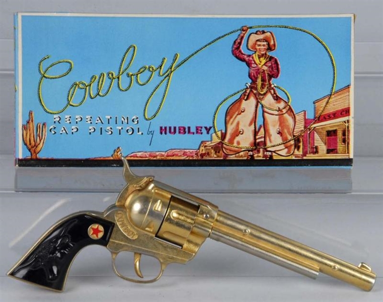 HUBLEY GOLD COWBOY CAP GUN.                       