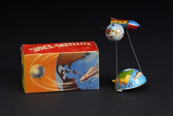 TIN SPACE SATELLITE LEVER-ACTIVATED TOY.          