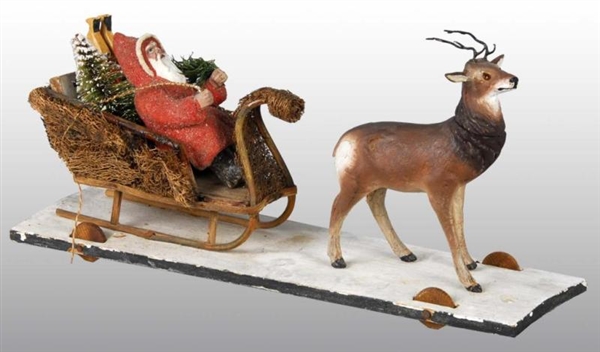 SANTA IN SLEIGH WITH REINDEER PULL TOY.           