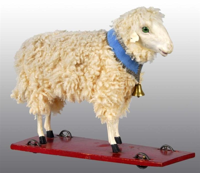 LARGE SHEEP PULL TOY WITH DRESDEN COLLAR.         