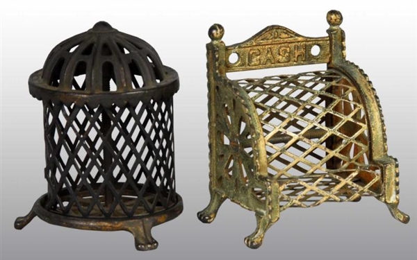 LOT OF 2: CAST IRON CAGE-STYLE STILL BANKS.       
