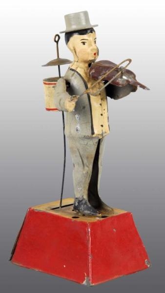 TIN HAND-PAINTED ONE MAN BAND WIND-UP TOY.        