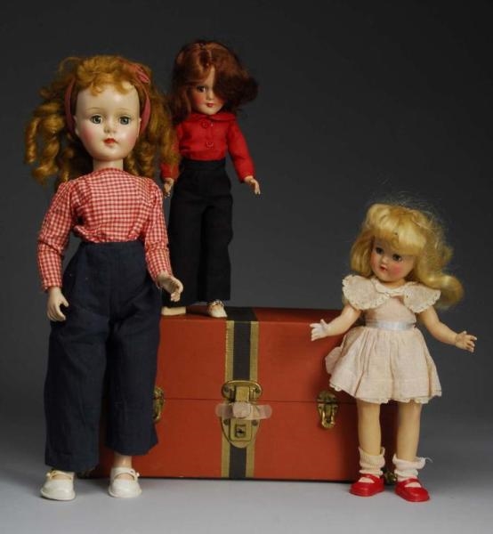 LOT OF 3: HARD PLASTIC DOLLS & TRUNK AND CLOTHES. 