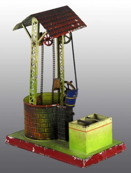 TIN HAND-PAINTED DOLL COMPANY WATERWHEEL TOY.     