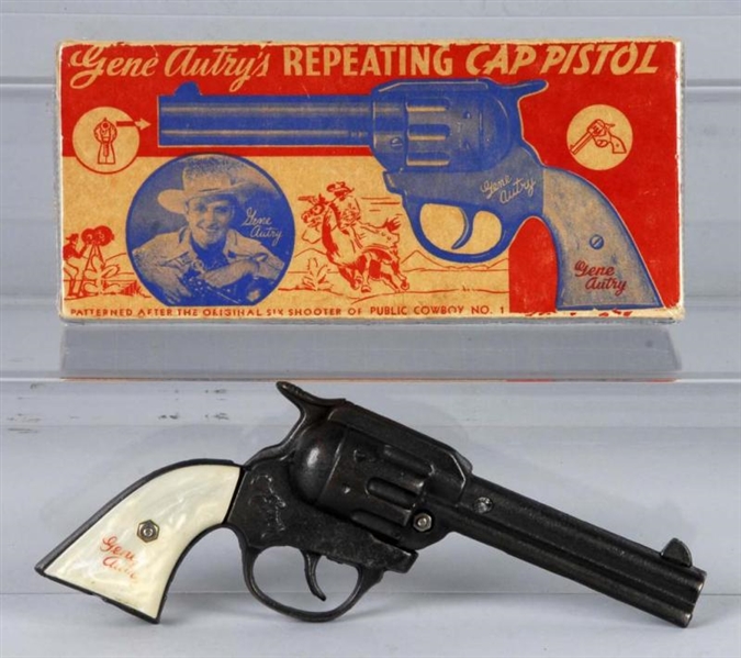 CAST IRON GENE AUTRY CAP GUN.                     
