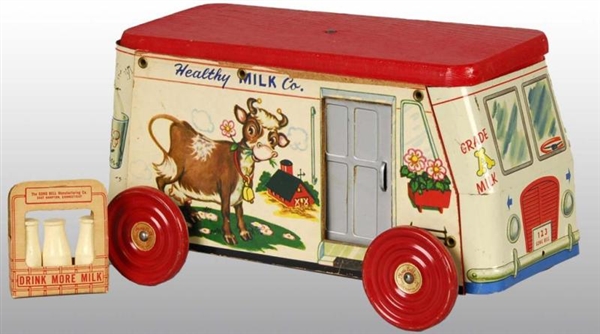 TIN LITHO GONG BELL HEALTHY MILK TRUCK TOY.       